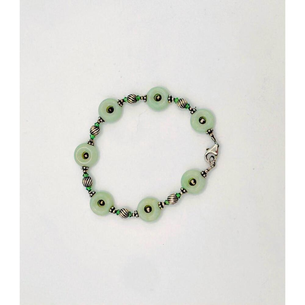 Sterling silver beads with jadeite open disc and silver bead center bracelet
